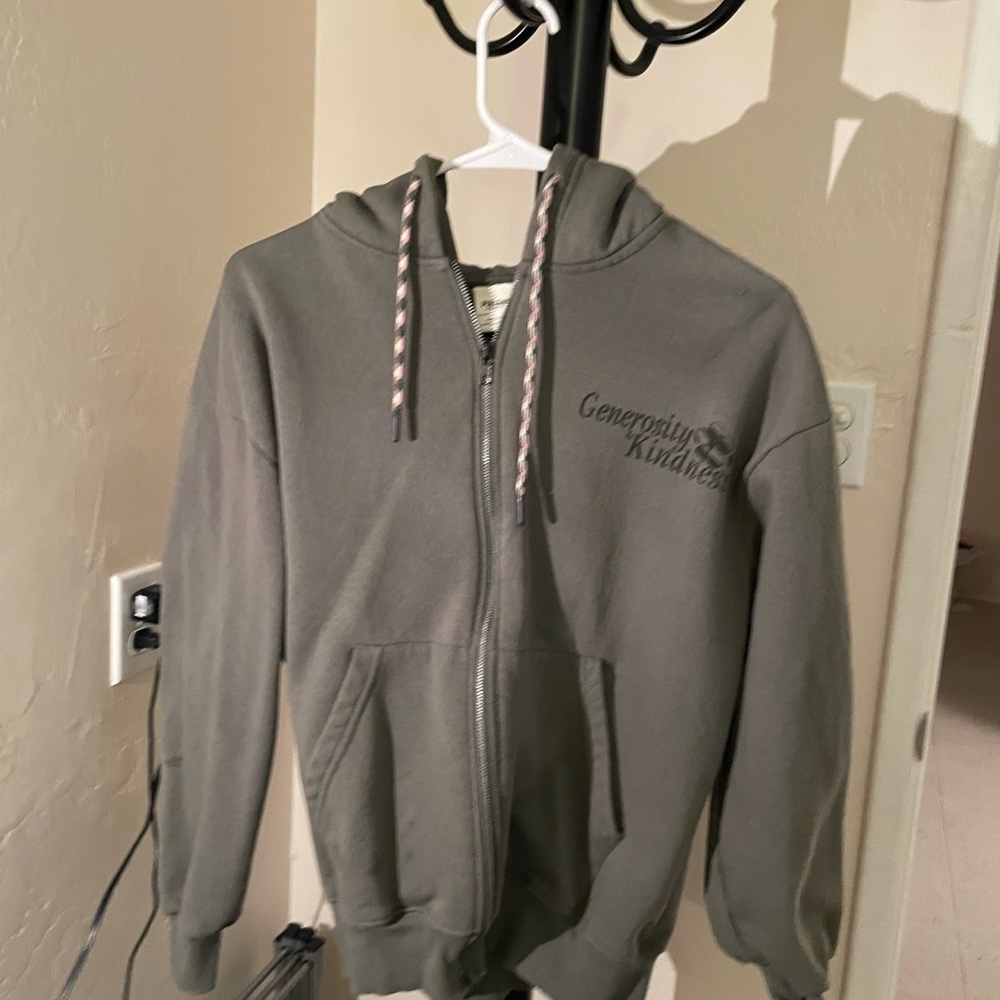 Woman’s green zip up